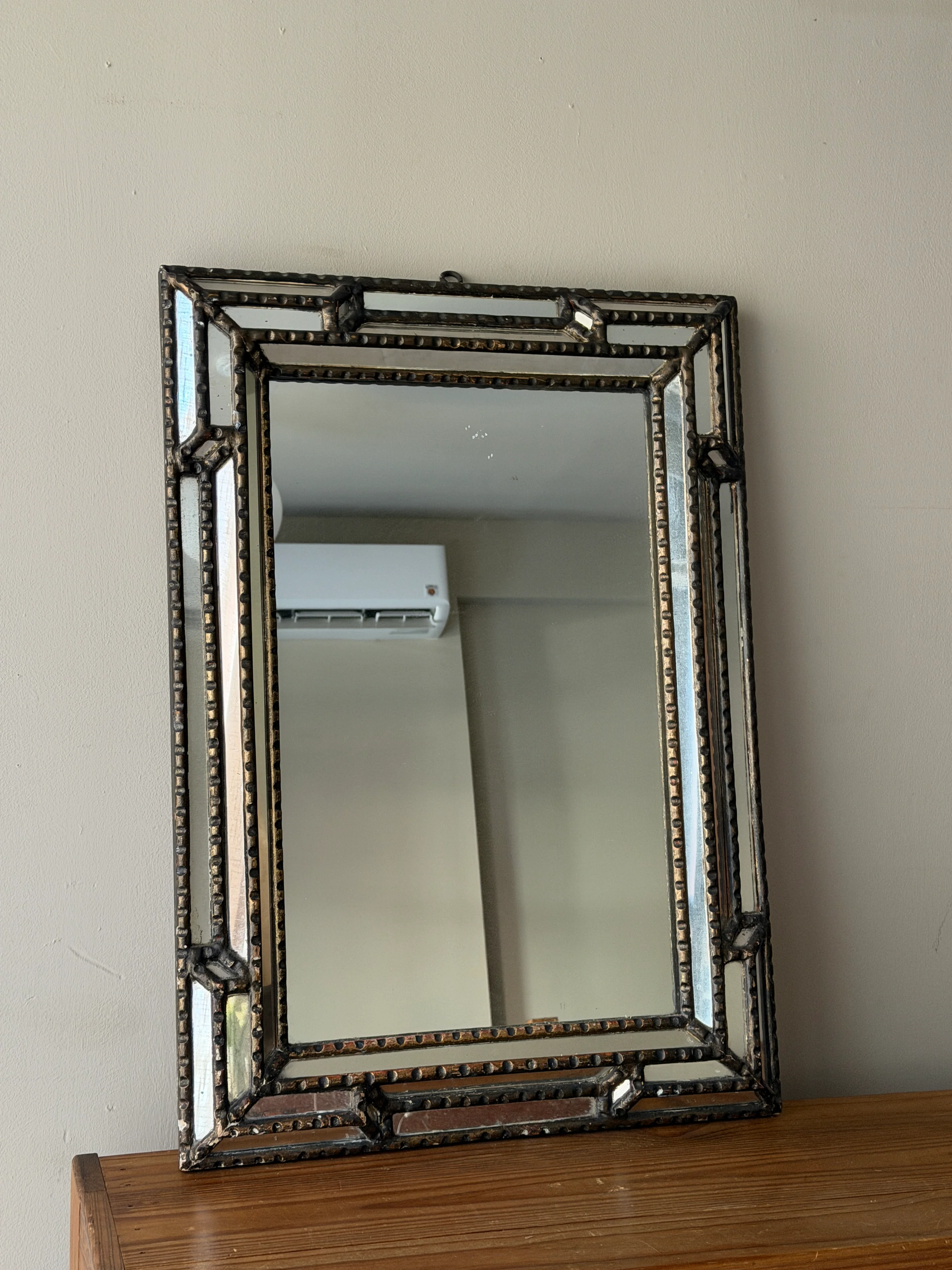 Beaded wall mirror