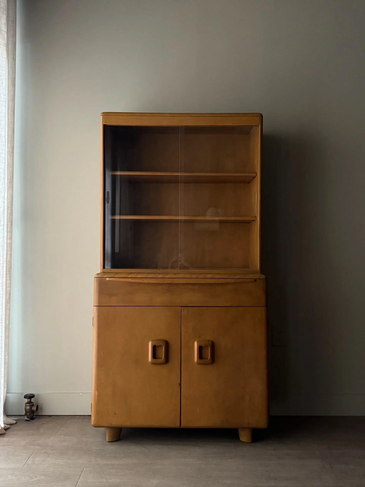 Heywood Wakefield maple two piece display cabinet