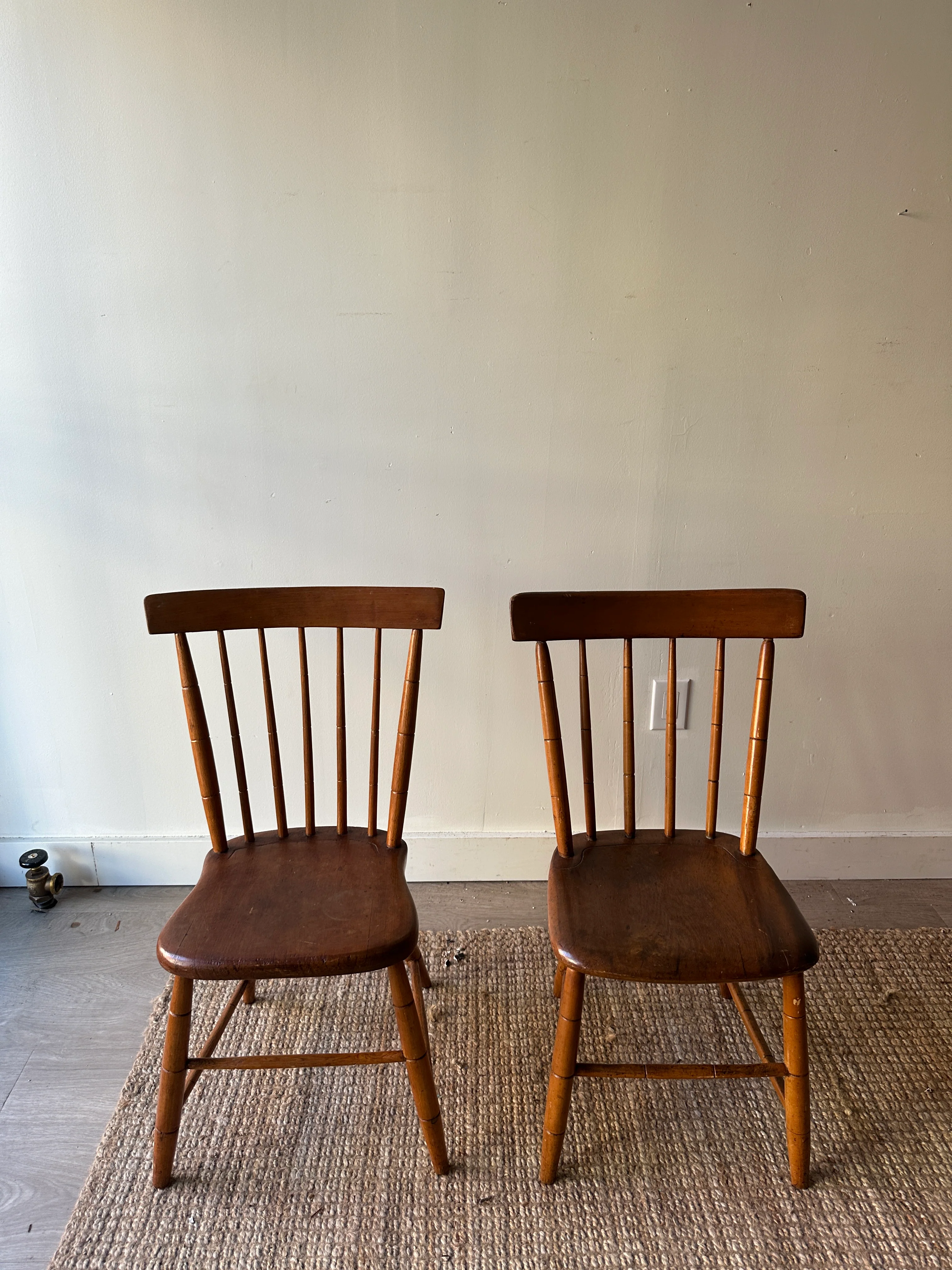 Pair of plank seat chairs. Sold together.